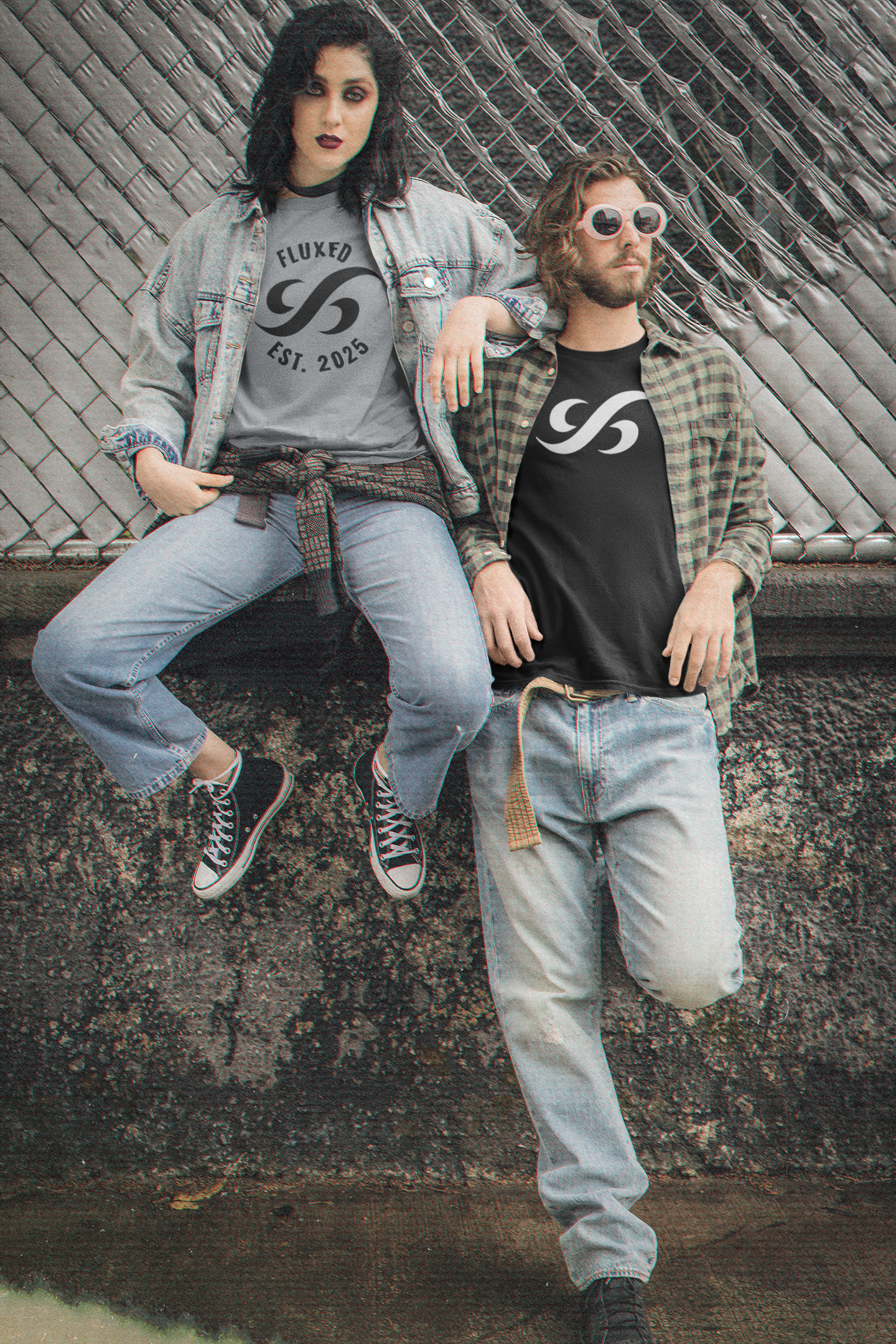 Two people sitting on a ledge wearing branded clothing with logos.